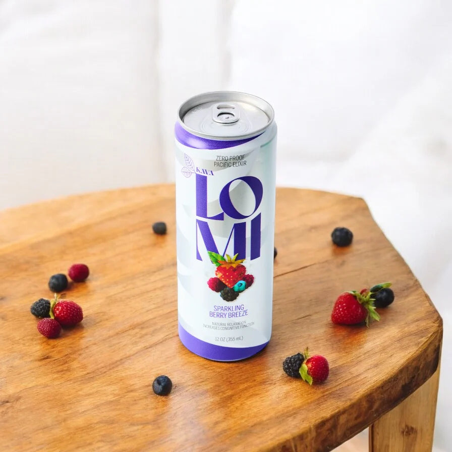 Lomi is a Kava beverage company we co-pack for. This is an image of one of their cans on top of a wooden table with assorted berries surrounding it.