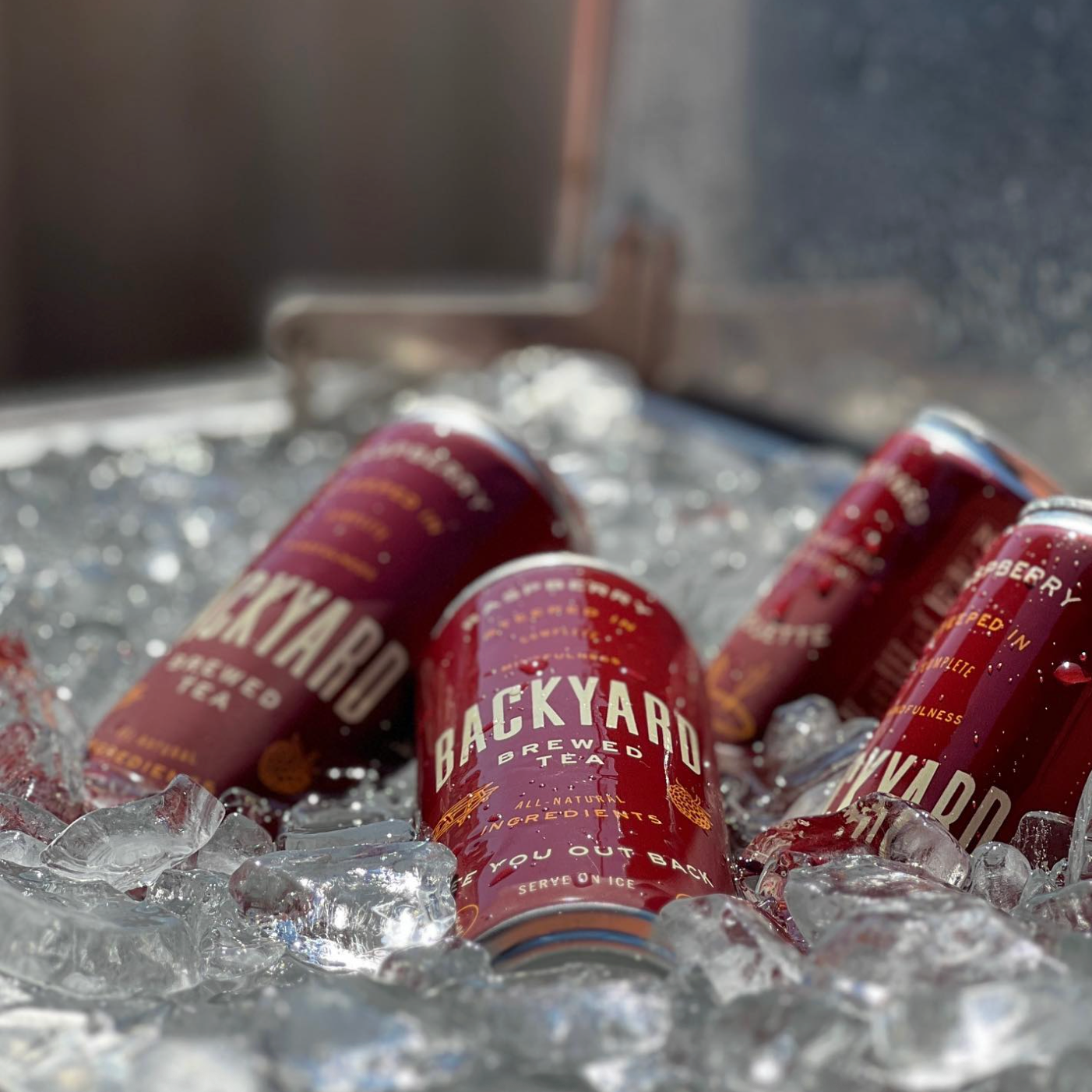 Backyard Tea is a THC beverage company we co-pack for. This is an image of their cans in a cooler with ice.