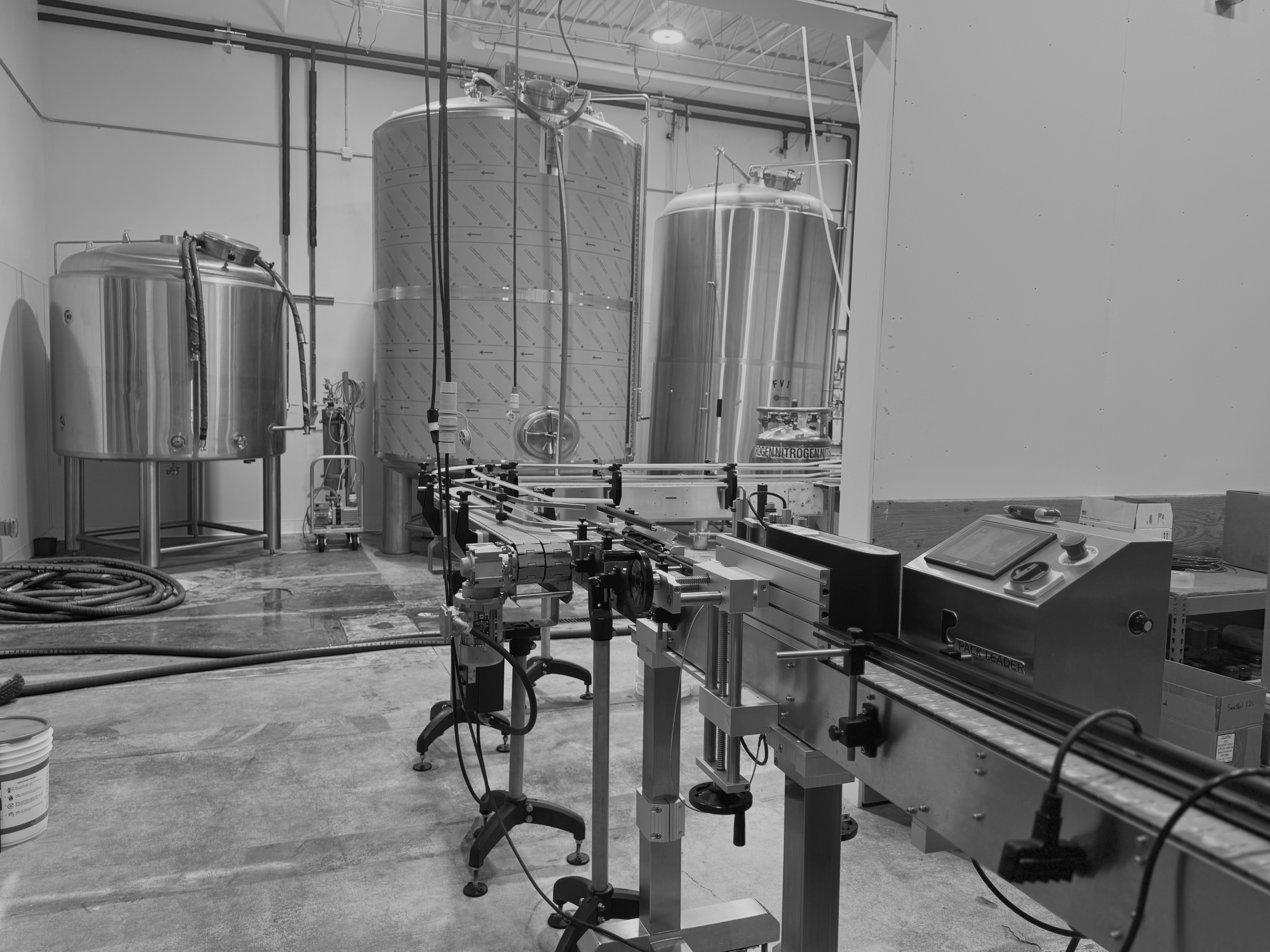 Picture of the holding tanks and canning line at Flying Cloud's beverage co-packing facility in Minnesota.